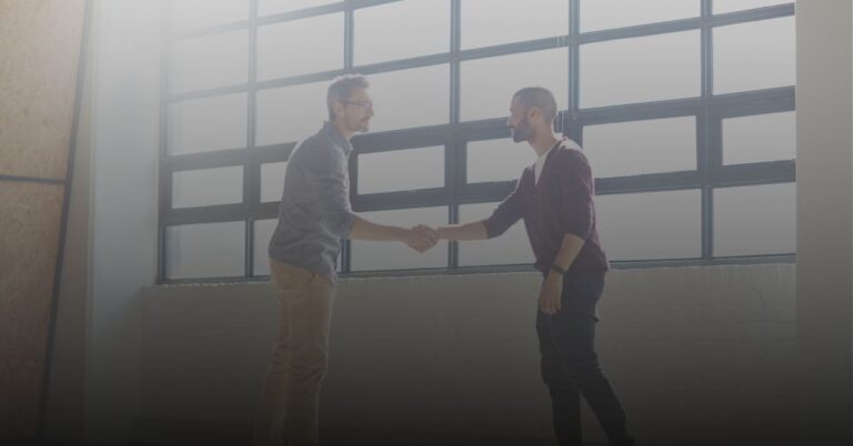 two men shaking hands in agrrement